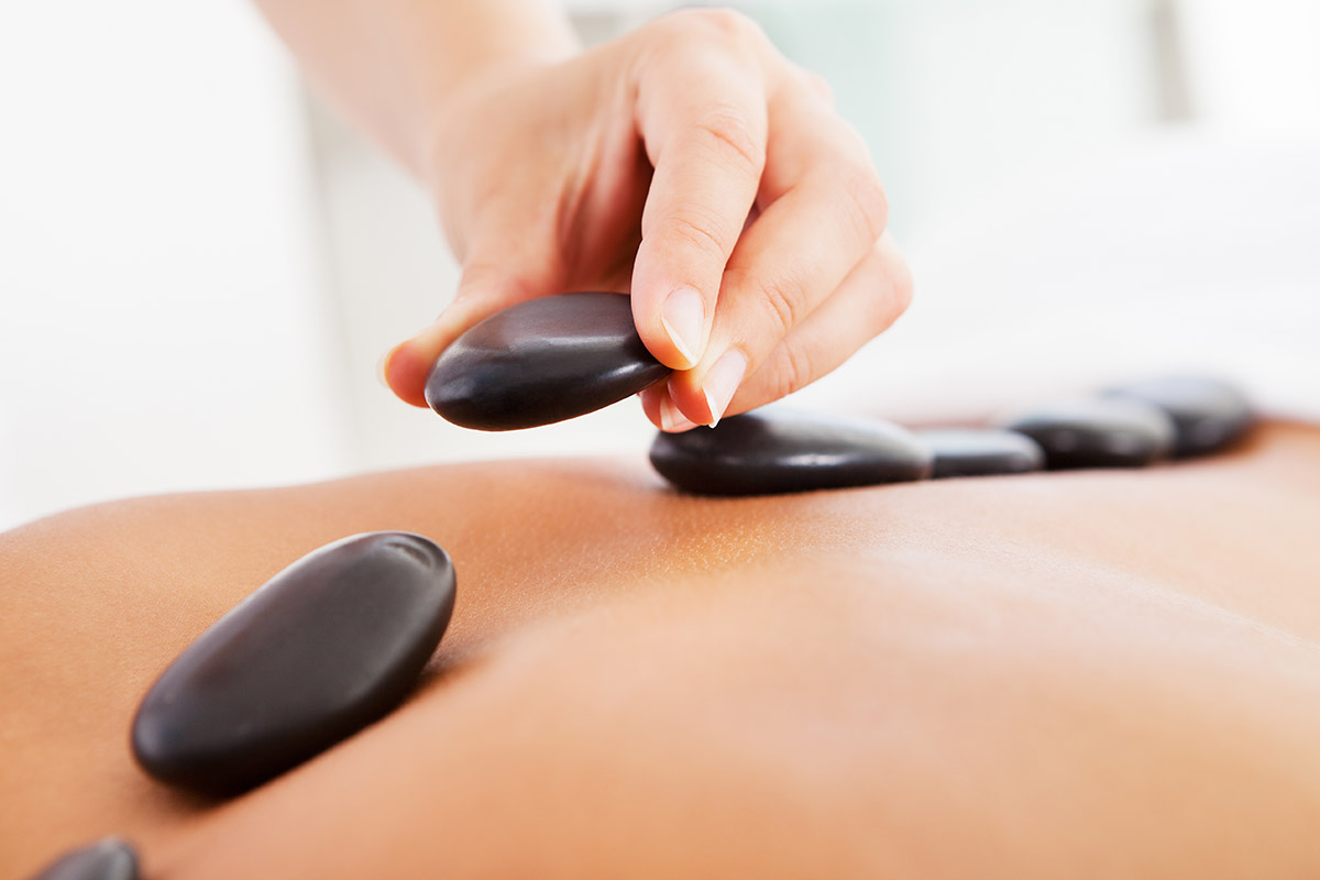 Young Man Relaxing In A Spa Getting Lastone Therapy